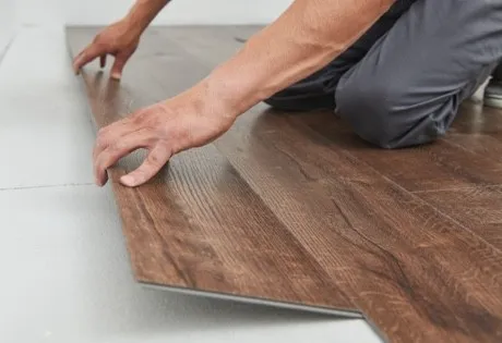 Worker installing lvp | Lions Floor
